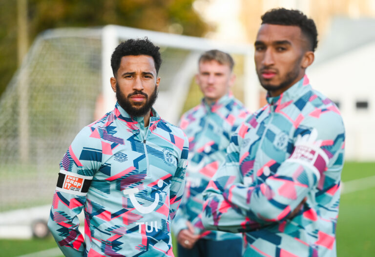 Luton Town players Jacob Brown, Andros Townsend and Alfie Doughty supporting the Just Drop It campaign