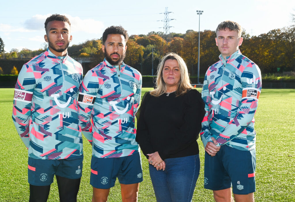 Luton Town players Jacob Brown, Andros Townsend and Alfie Doughty with Roseann Taylor